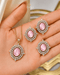 Pink AD stone Jadau pendant set with matching earrings held in hand - Jewels by Sarah Signature Collection