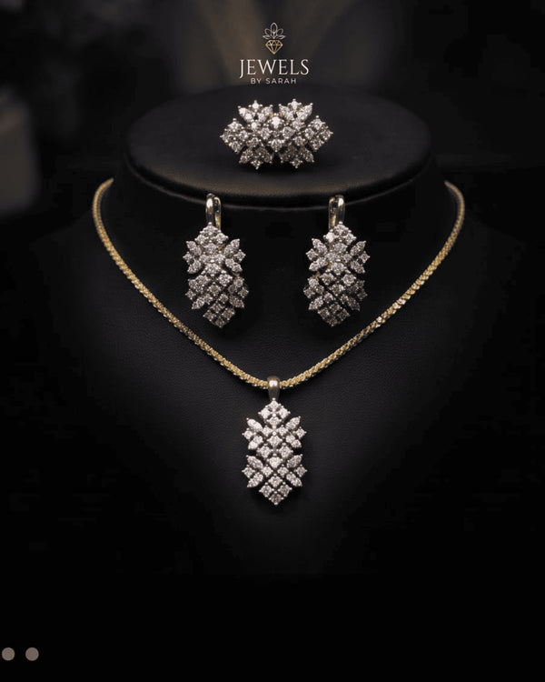 Gold diamond cut zircon leaf drop necklace and earrings styled on display bust – Jewels by Sarah