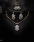 Gold diamond cut zircon leaf drop necklace and earrings styled on display bust – Jewels by Sarah