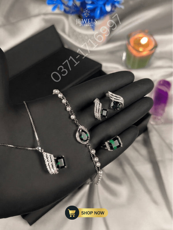 Emerald green 4-piece jewelry set for Pakistani wedding guest attire.