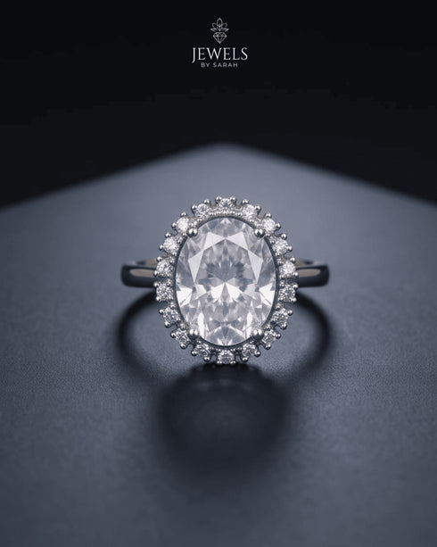 "Clear crystal oval halo statement ring on dark background by Jewels by Sarah"