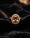 "Champagne oval halo statement ring with crystal halo on black velvet by Jewels by Sarah"