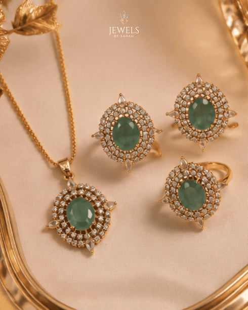 Green AD stone Jadau pendant and rings displayed in gold tray - Jewels by Sarah