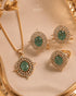 Green AD stone Jadau pendant and rings displayed in gold tray - Jewels by Sarah