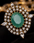 Close-up of green centerstone and AD stone halo on Jadau pendant - Jewels by Sarah 22K gold polish