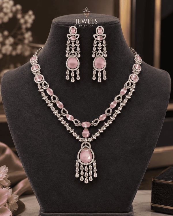 Pink stone silver plated bridal necklace set with tikka on mannequin