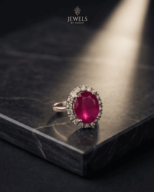 "Ruby red oval halo statement ring with crystal halo on marble by Jewels by Sarah"