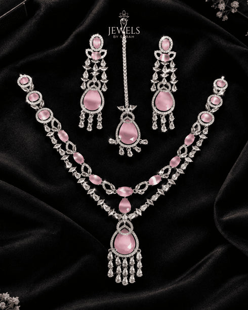 Silver plated pink and AD stones bridal jewelry set on black velvet flatlay