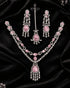 Silver plated pink and AD stones bridal jewelry set on black velvet flatlay