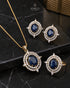 Blue AD stone Jadau pendant set with matching earrings and ring on marble - Jewels by Sarah Signature Collection