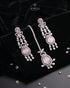 Close up of pink stone drop earrings and tikka with AD stone detailing