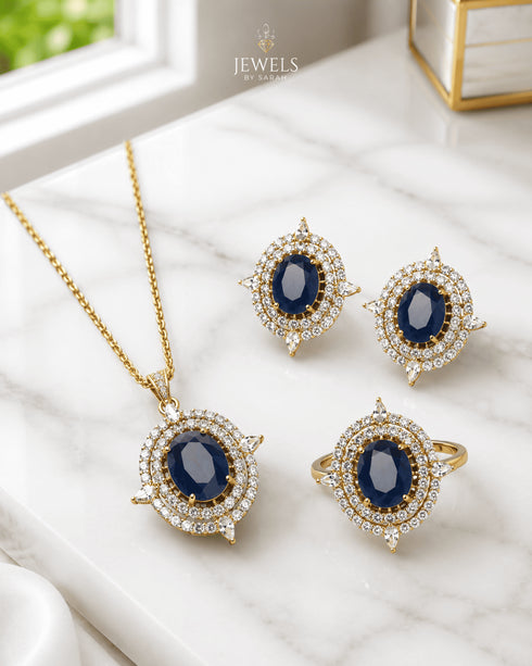 Blue AD stone Jadau pendant set with matching earrings and ring on marble - Jewels by Sarah Signature Collection