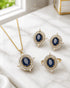 Blue AD stone Jadau pendant set with matching earrings and ring on marble - Jewels by Sarah Signature Collection