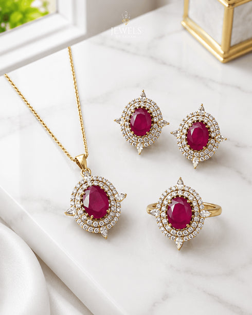 Ruby red AD stone Jadau pendant set with matching earrings and ring on marble - Jewels by Sarah 22K gold polish