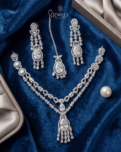 Silver plated original AD stones bridal jewelry set on blue velvet flatlay
