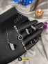 Midnight black stone designer jewelry set with silver pave detailing.