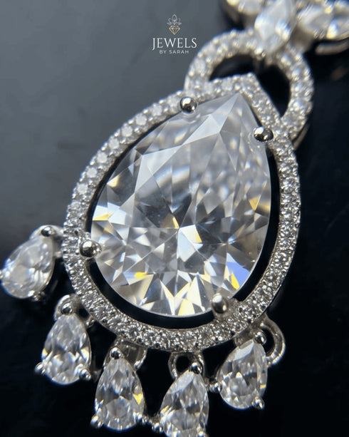 Macro shot of pear cut AD stone pendant with silver plated detailing