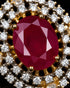 Close-up of ruby red centerstone and AD stone halo on Jadau pendant - Jewels by Sarah
