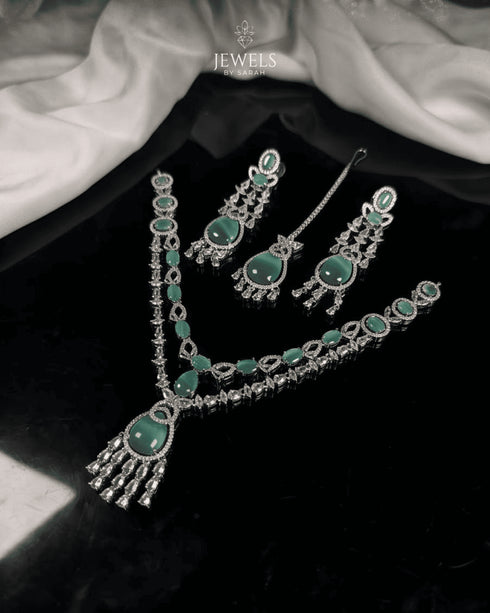 Silver plated mint green and AD stones bridal jewelry set flatlay