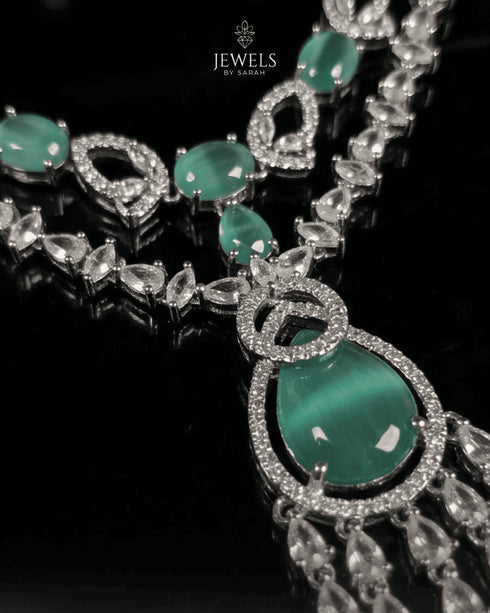 Close up of mint green stone pendant with AD stone detailing