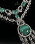 Close up of mint green stone pendant with AD stone detailing