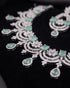 Close up view of mint green stone necklace with floral AD design