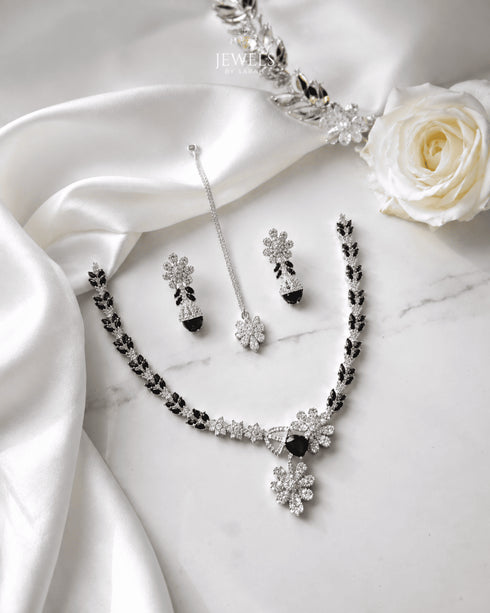 "Black AD bridal necklace set with tikka and earrings on white satin by Jewels by Sarah"