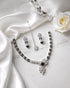 "Black AD bridal necklace set with tikka and earrings on white satin by Jewels by Sarah"
