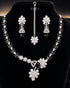 "Black American diamond necklace set with matching tikka and earrings on display"