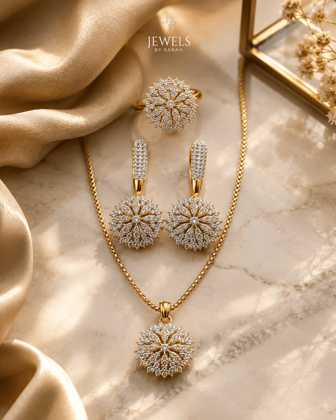 "22K gold plated sunburst zircon necklace set with earrings and ring on marble by Jewels by Sarah"