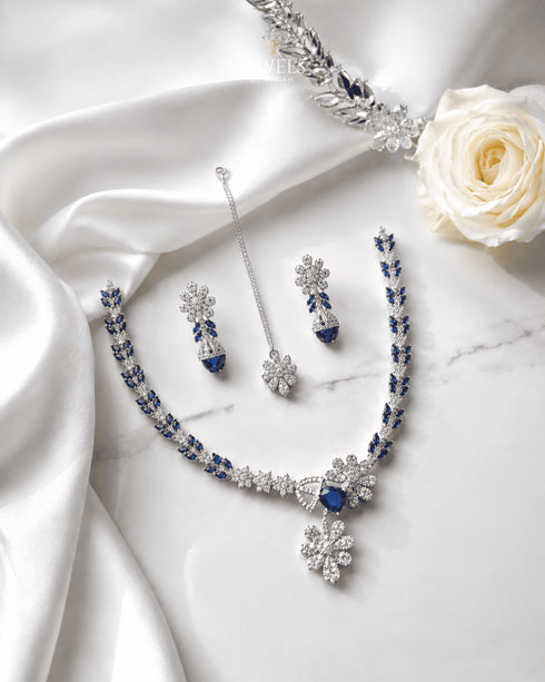 "Royal blue AD bridal necklace set with tikka and earrings on white satin by Jewels by Sarah"