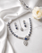 "Royal blue AD bridal necklace set with tikka and earrings on white satin by Jewels by Sarah"