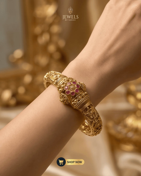 Model wearing the Floral Ruby Signature Bangle from Jewels by Sarah.