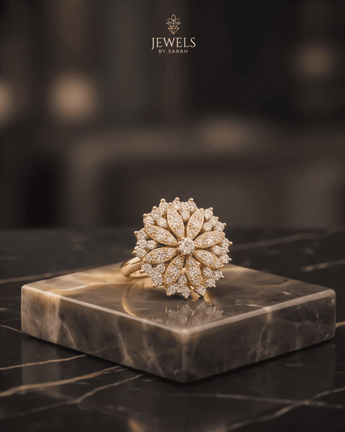 "Close-up of diamond-cut zircon floral ring in 22K gold plating by Jewels by Sarah"