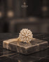 "Close-up of diamond-cut zircon floral ring in 22K gold plating by Jewels by Sarah"