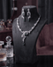 "Emerald green AD vine necklace set with matching earrings on display bust by Jewels by Sarah"