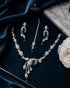 "Emerald green AD vine necklace set with tikka and earrings on navy velvet by Jewels by Sarah"