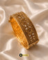 Jewels by Sarah 24K gold plated broad signature bangle with floral AD stone carvings on cream silk.