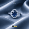 Signature Royal oval sapphire blue ring with marquise halo on blue silk