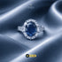 Signature Royal oval sapphire blue ring with marquise halo on blue silk