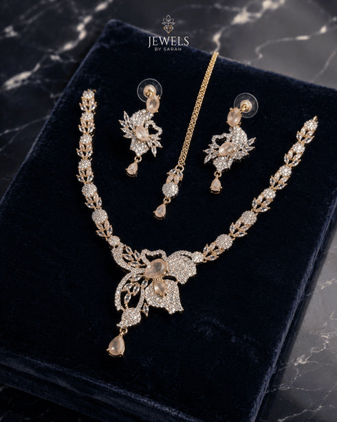 Mint pink gold AD butterfly necklace set with tikka and earrings on navy velvet by Jewels by Sarah"