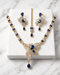 "Royal blue gold AD butterfly necklace set with tikka and earrings on marble by Jewels by Sarah"