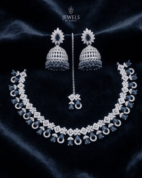 "Sapphire blue AD jhumka necklace set with tikka and earrings on navy velvet by Jewels by Sarah"