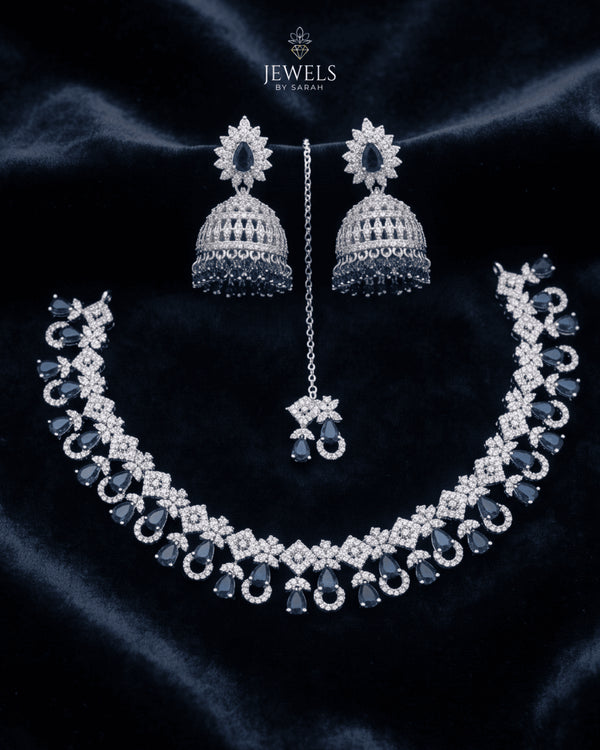 "Sapphire blue AD jhumka necklace set with tikka and earrings on navy velvet by Jewels by Sarah"