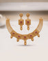 South Indian gold polish choker set with ruby stone motifs and earrings