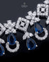 "Close-up of sapphire blue AD stones and floral necklace detailing by Jewels by Sarah"