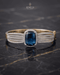 Sapphire blue zircon statement bangle bracelet on dark marble – Jewels by Sarah