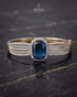 Sapphire blue zircon statement bangle bracelet on dark marble – Jewels by Sarah