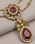 Close-up of South Indian ruby pendant with bird motif and teardrop stone in 22K gold polish - Jewels by Sarah