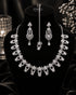 "Silver white AD scalloped necklace set with tikka and earrings on display bust by Jewels by Sarah"
